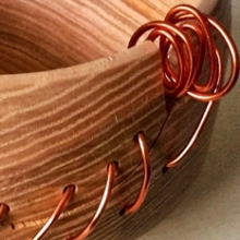 Hand turned bowl with copper coloured aluminium wire