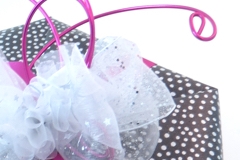 Hexagon wrapped in paper with wire and ribbon decoration