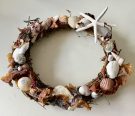 Willow wreath decorated with seashells and seaweed