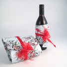 Bottle wrapped in a cummerbund and a gift wrapped in a pouch